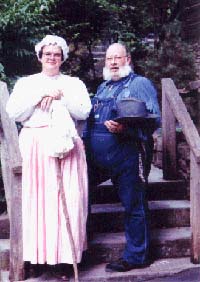 Richard & Judy standing on the steps of the Homestead Cabin, Silver Dollar City, Branson, MO.