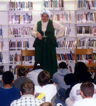 photo of Judy telling stories to a group of Middle Schoolers